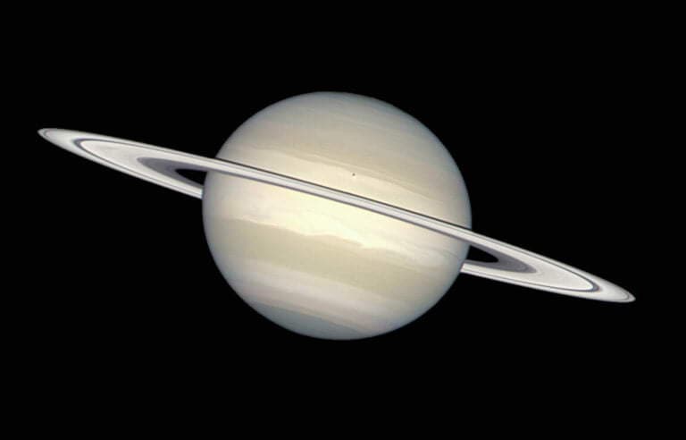What is the color of Saturn in the picture?