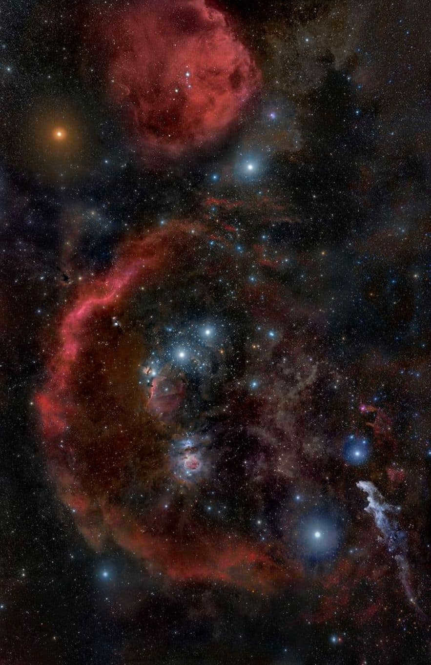 An image from 2010 shows the nebular complex of Orion's Molecular Cloud. Also visible is the red supergiant Betelgeuse (top left) and Orion's belt, which includes Alnitak, Alnilam, and Mintaka. Rigel resides below, and the red crescent moon is Bernard's loop