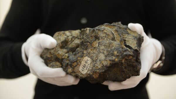 A fragment of the Chelyabinsk meteorite. Archival photo