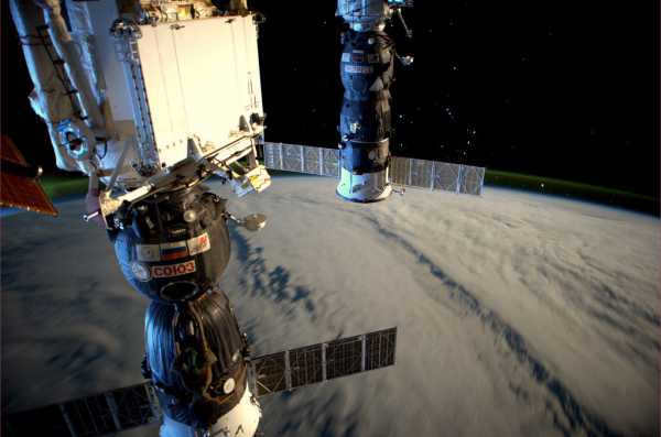 Station in the moonlight, Soyuz ships visible