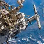 Astronauts Steven G. MacLean and Daniel C. Burbank work outside the ISS
