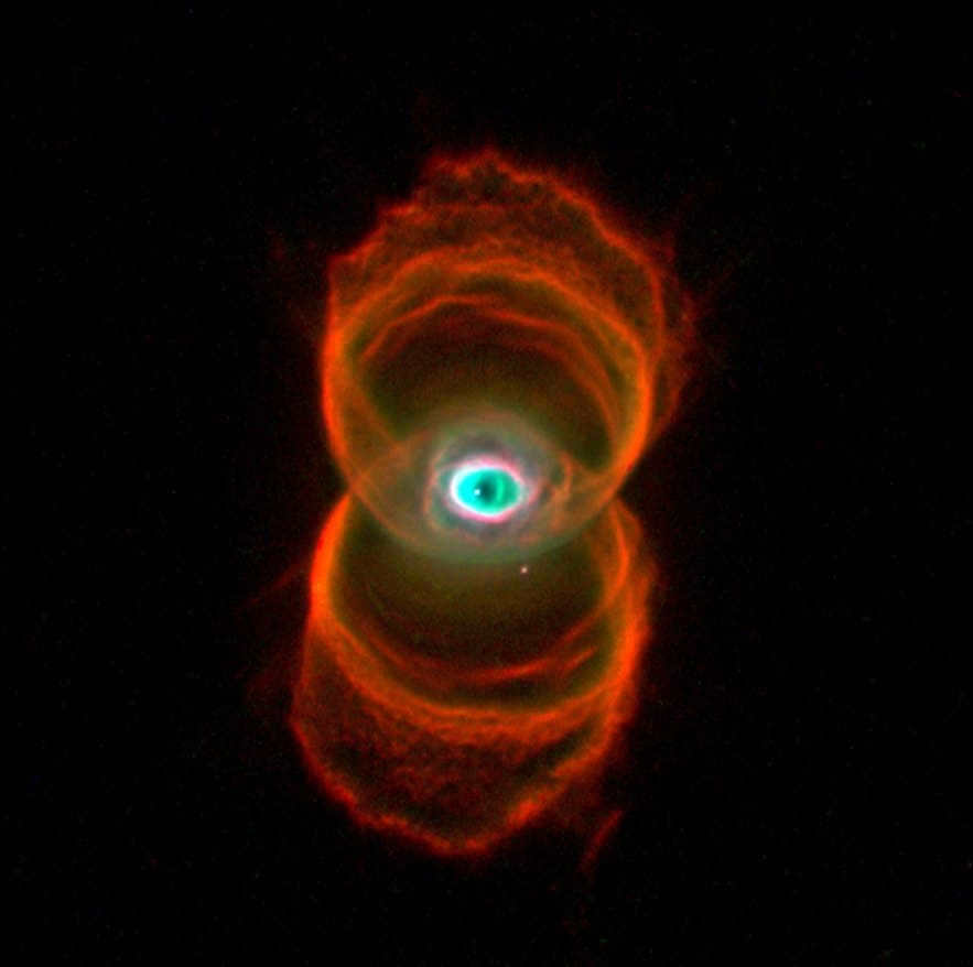 In front of you is an amazing shot of the young nebula (planetary) MyCn 18. The Hubble camera managed to capture it at a distance of 8,000 light years. This shows the actual silhouette, resembling an hourglass with interesting "patterns" on the walls. They used 3 different frames for this image, created in the light of ionized nitrogen (in red), doubly ionized oxygen (in blue) and hydrogen (in green). Scientists are still trying to understand the process of stellar matter ejection that accompanies the death of Sun-like stars. And this image helps to better understand this mechanism. Unlike previous images, this one reveals fine details. 