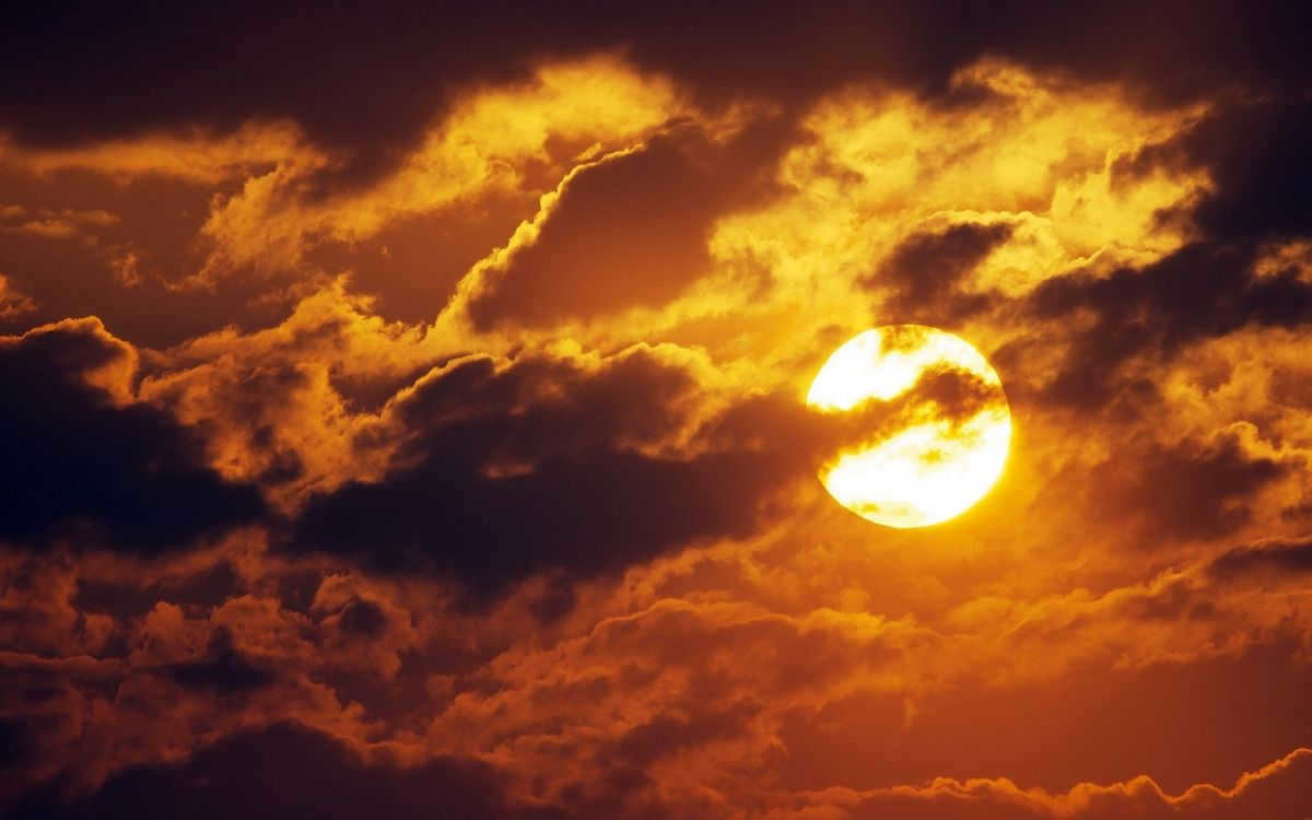 Sun among clouds