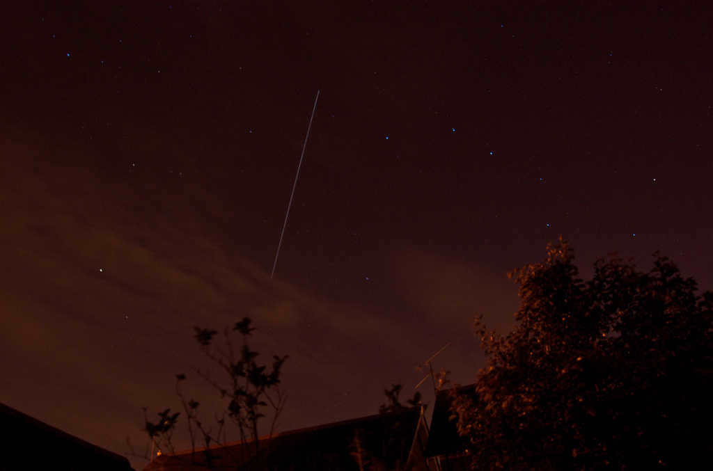 Flight against the background of the Big Dipper constellation