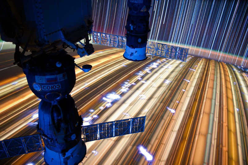 Soyuz series spacecraft against the background of the Earth