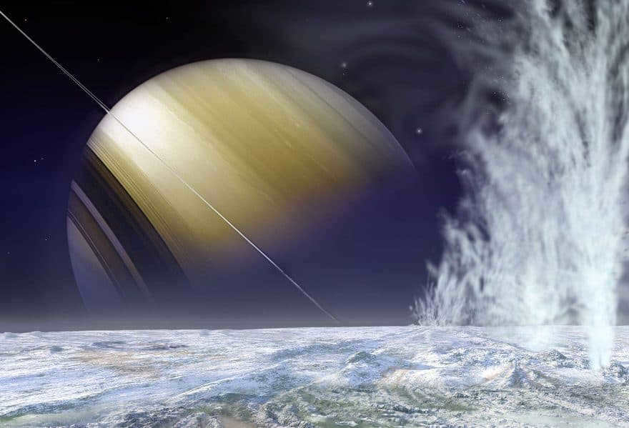 A view of Saturn from Enceladus. Geysers erupt in the foreground.