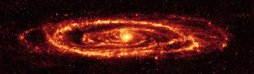 The Spitzer telescope has managed to take beautiful images in infrared light. This is the sharpest image (24-micron mosaic) showing the galactic dust. This was possible because Andromeda is located 2.5 million light-years away. It took 11,000 separate frames to create this image. The ring shows asymmetry and appears to be split in two, creating a gap (lower right corner). Contact with satellite galaxies most likely led to this.