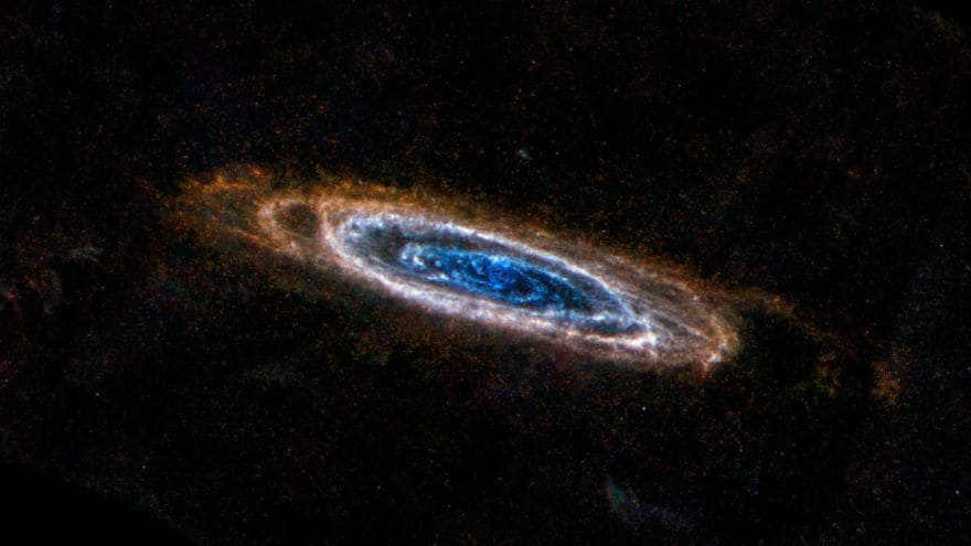 The spitzer shows evidence of spiral arms inside the ring, stretching toward the very center. Stellar scattering is evident within, but only a few wrapped in dust cocoons show up in infrared light. This is different from visible light images, which show starlight rather than dust. A large bulge stands out in the center.