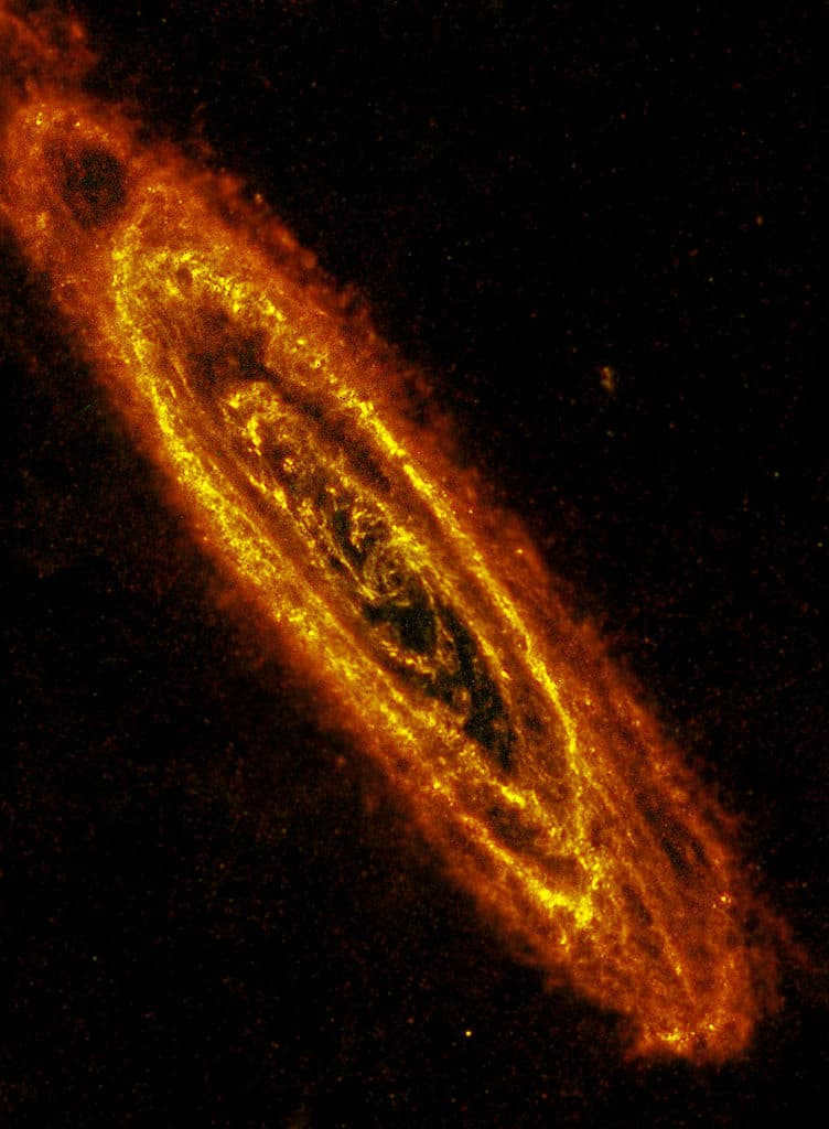 M31 is 2.5 million light years away from us and is our nearest neighbor. It spans 260000 light-years. This is such a huge distance that 10 GALEX frames had to be combined for this image. The blue bubbles inside the spiral arms are regions filled with hot and young stars. The cool and ancient ones, on the other hand, reside in the orange and white ball. This is a very bright galaxy observed with the naked eye. The image taken shows a two-color composite, where blue is ultraviolet light and red is near-ultraviolet light