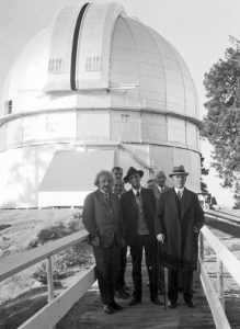 Hubble and colleagues at the Mount Wilson Observatory. The domed roof could be extended and the telescope could "observe" the night sky.