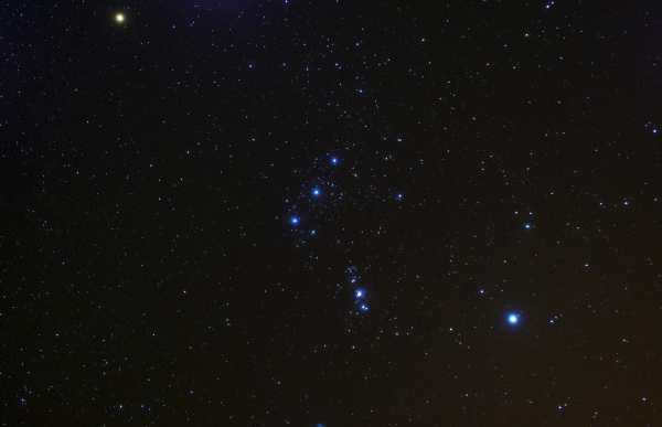 Three stars Alnitak (Orion's ζ), Alnilam (Orion's ε), Mintaka (Orion's δ) in the center of the image - Orion's Belt