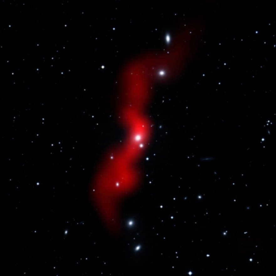 3C 31 is a radio galaxy. It is an amalgamation of visible light data from the Digital Sky Survey with radio waves from the NVSS survey (red). Long radio jets are produced by the supermassive black hole at the center of the galaxy.