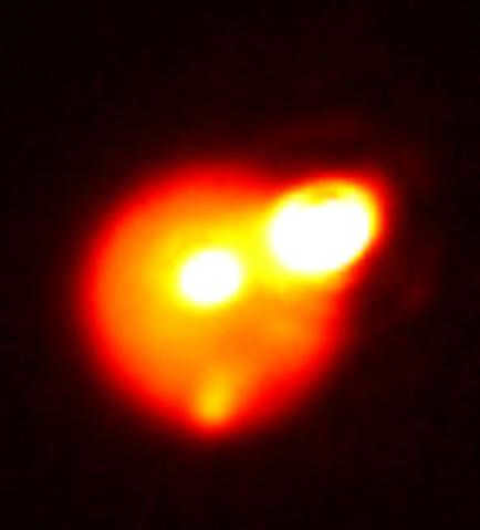 Io is an enigmatic satellite of Jupiter, home to volcanoes and auroras