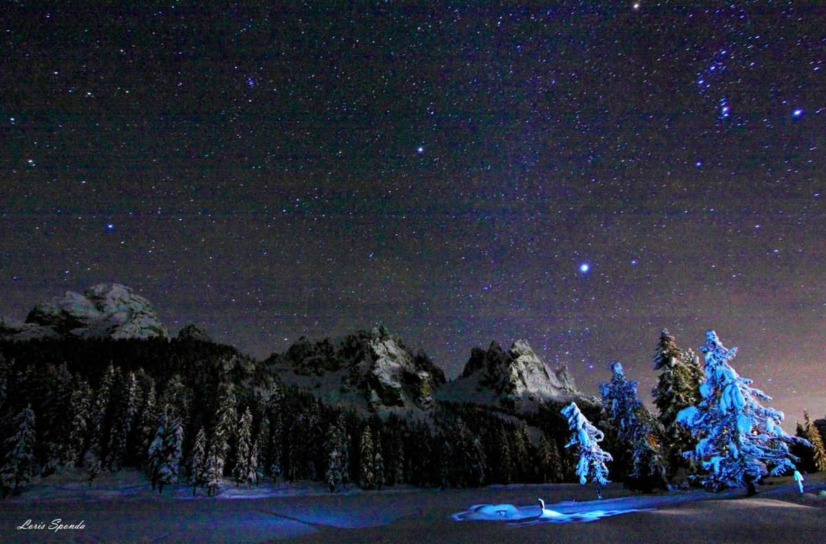 Night sky in Alps and Beehive open cluster