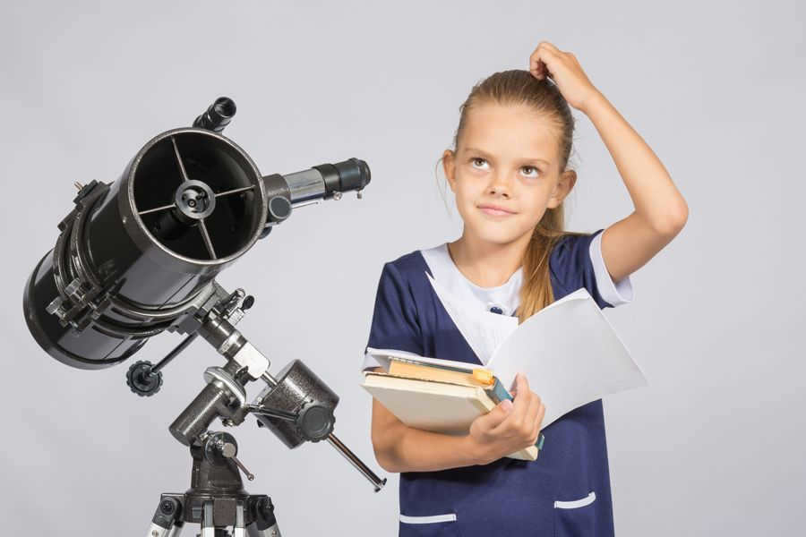 Astronomy with a child, studying the starry sky in the telescope