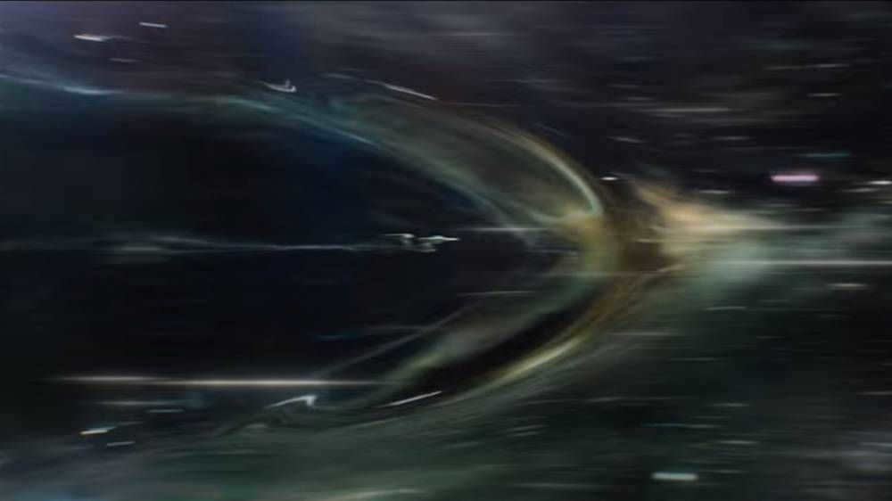 This is how the Alcubierre bubble works. It is created by warp nacelles at the rear of the starship. They get their power from the hyperdrive core. Source: Paramount