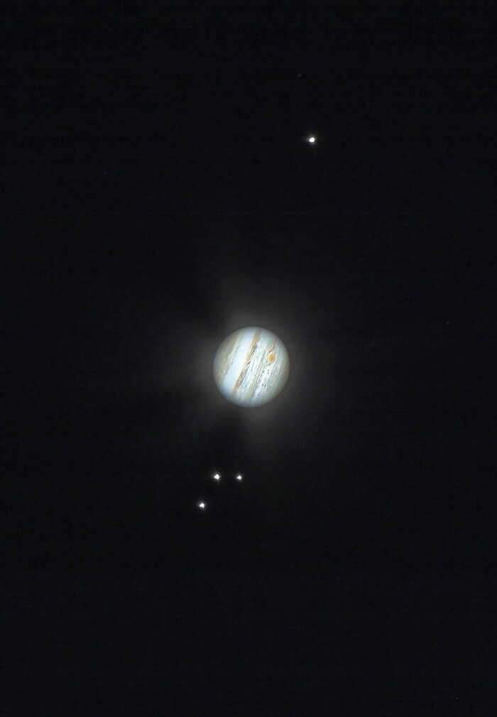 Jupiter and its largest satellites in an 8-inch telescope image