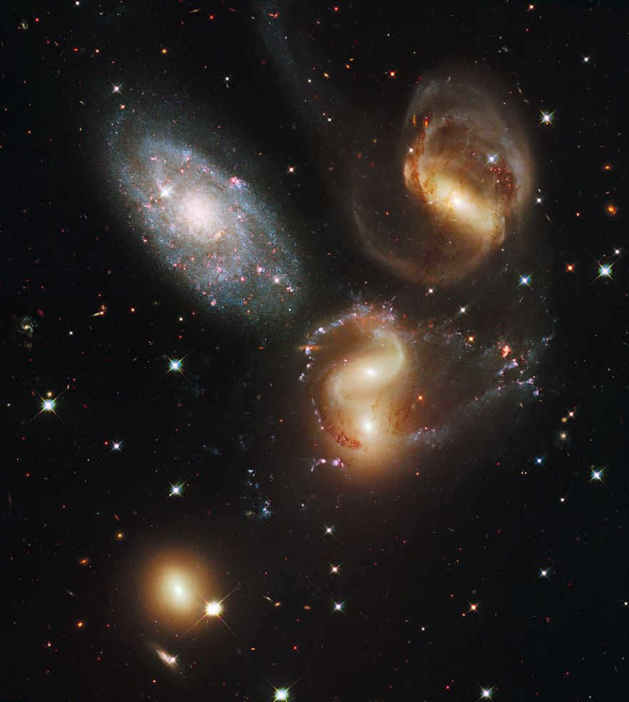 This is Stephan's Quintet, taken by the Hubble Space Telescope. However, the title is a bit of a misnomer. Quintet - stands for the number "5," but research has shown that NGC 7320 (top left) is a foreground galaxy 7 times closer to us than the rest of the group.