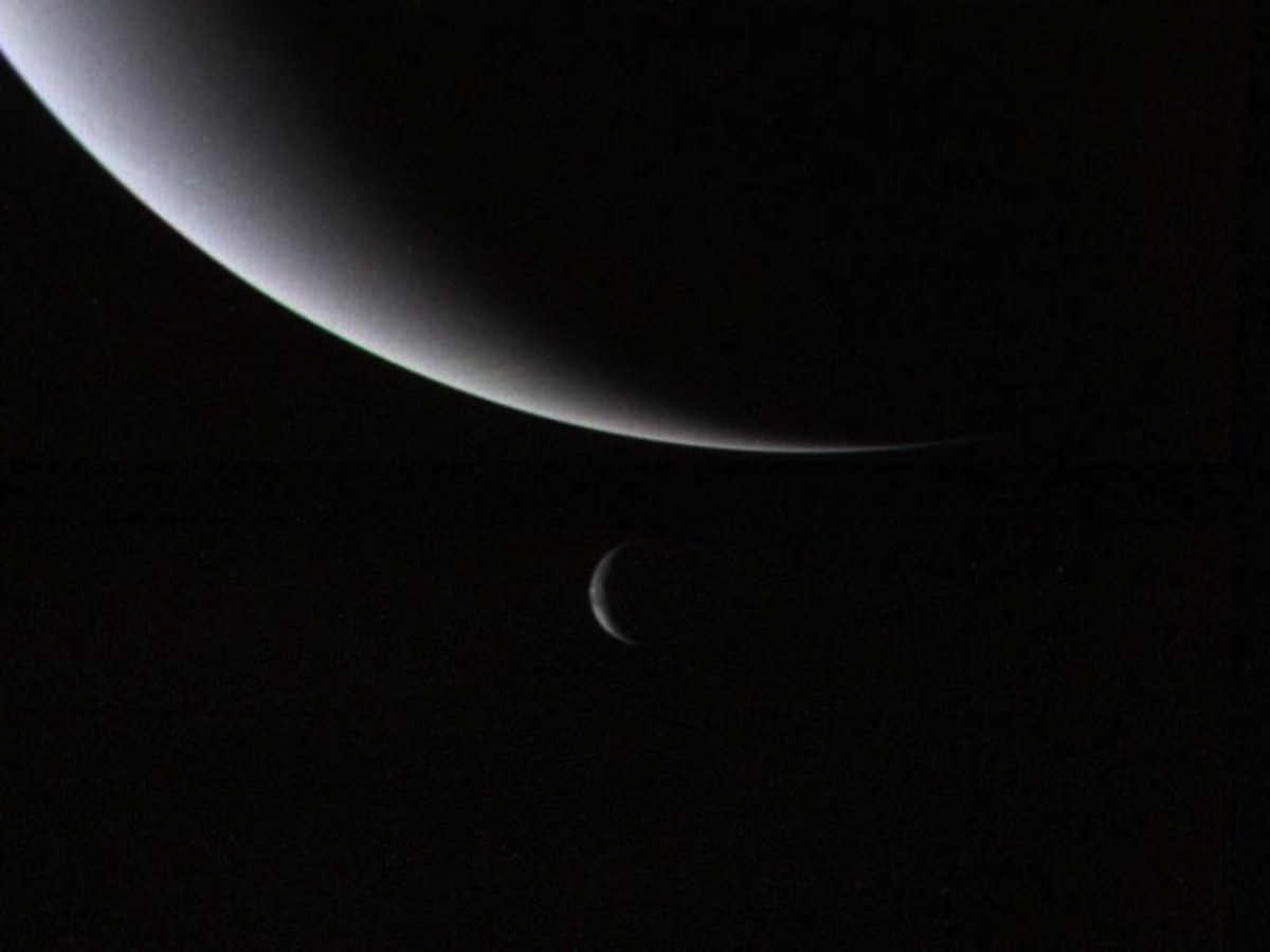 The crescents of Neptune and Triton.
