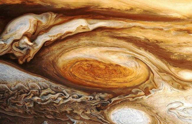 Hurricane in the atmosphere of Jupiter, the largest planet in the solar system.