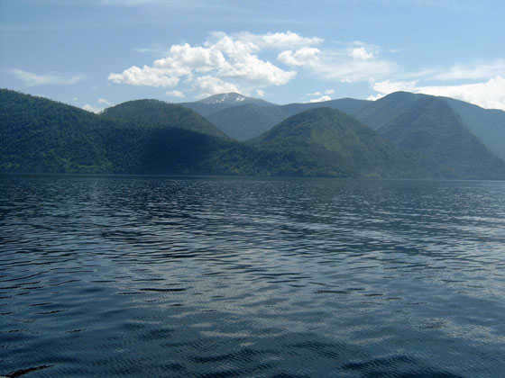 PLANET EARTH consists of a thin solid shell (crust) surrounded by a thick water hydrosphere and a dense atmosphere