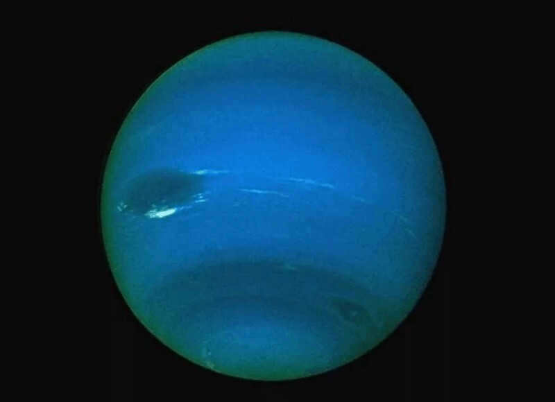 1. "Dark spots on the planet's surface.