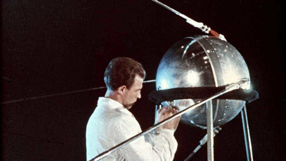 When and by whom was the first artificial earth satellite launched?