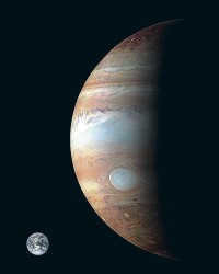 Comparative sizes of the Earth (bottom left) and Jupiter.