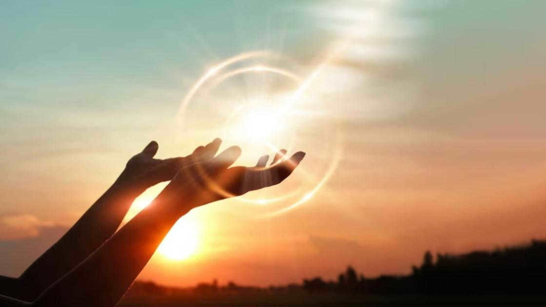 Hands outstretched to the sun