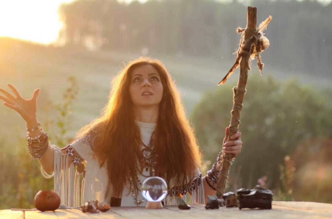 A girl performing a pagan ritual.