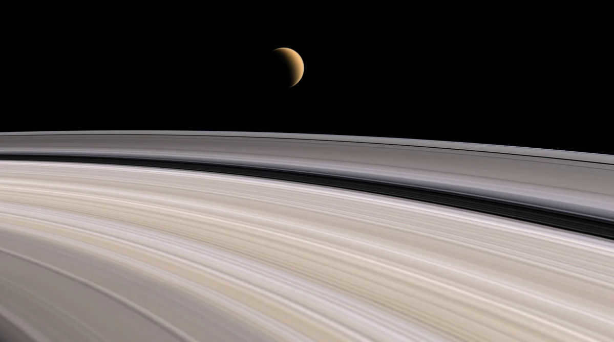 Saturn's rings and the satellite Titan. Photo of the probe 