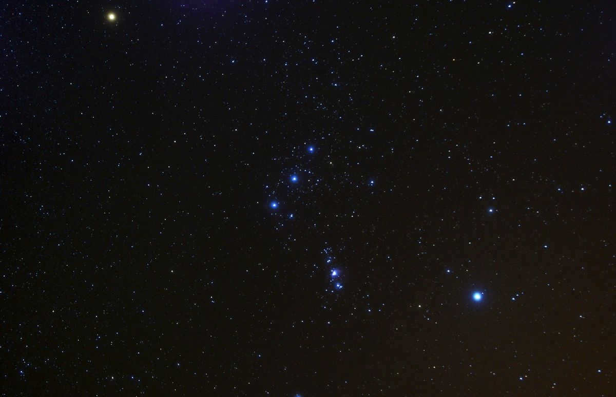 The three stars Alnitak (Orion's ζ), Alnilam (Orion's ε), Mintaka (Orion's δ) in the center of the image are Orion's Belt.