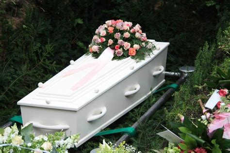 Why do they put money in a coffin?