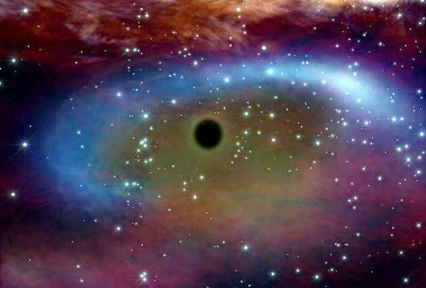 A supermassive black hole consumes the matter of the star orbiting around it (as imagined by the artist)