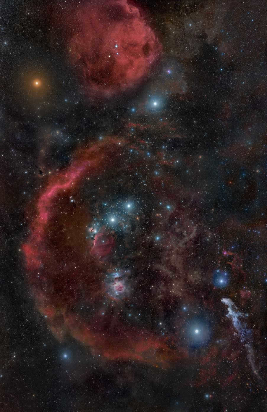 Orion's stars, captured in October 2010. Also noted here are the Orion Molecular Cloud nebulae, the red supergiant Betelgeuse (upper left), Rigel (lower right), and Barnard's Loop (a red crescent shape).