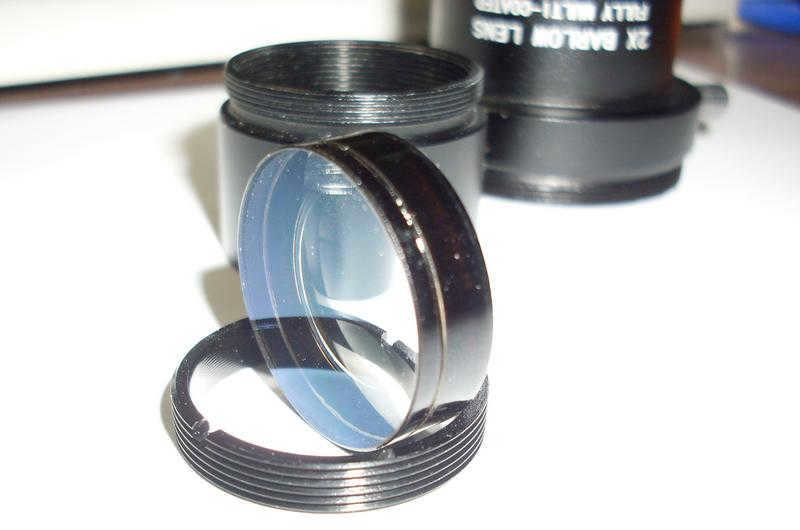 The lens is glued together from two glass lenses.