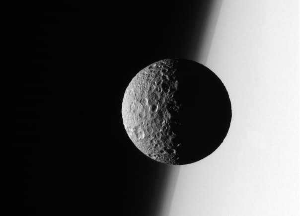 Mimas in the background of Saturn, image by the Cassini spacecraft