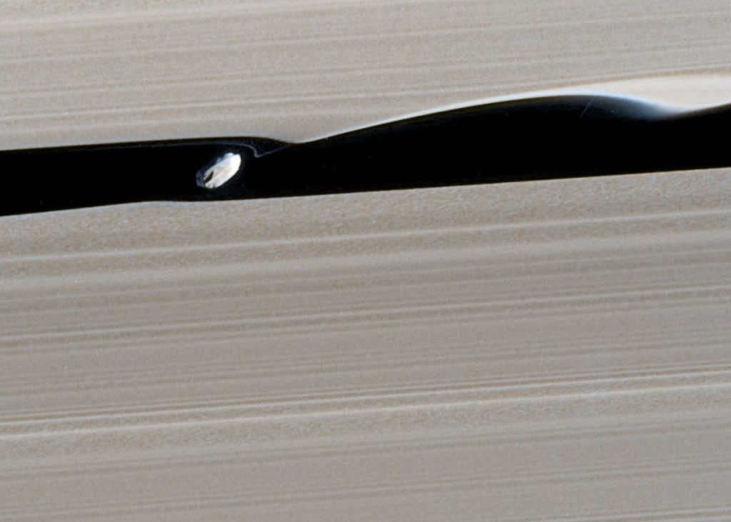 The Daphnis satellite "blows" waves across the Killer Slit. Cassini image