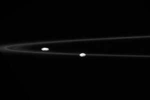 Saturn's satellites Prometheus, Pandora, and the F ring.