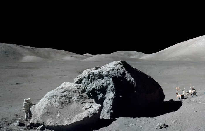 American astronaut X. Schmitt near a lunar rock