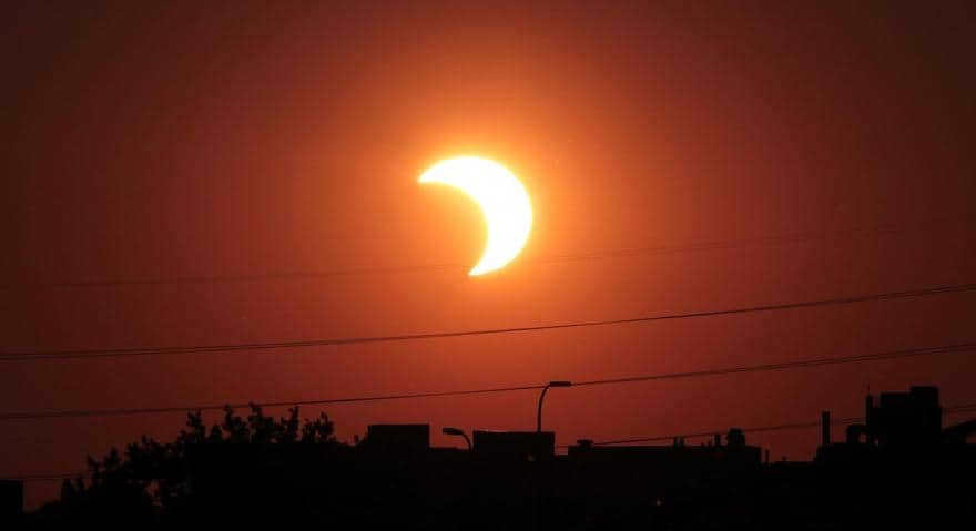 A partial solar eclipse occurs when the Moon hides only a portion of the Sun from viewers