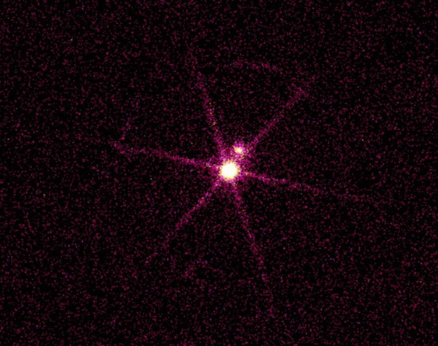 X-ray image of the system of Sirius, residing 8.6 light-years away from us. There are two sources in front of you, where the bright one is Sirius B, a white dwarf heated to 25,000°C. The dim light comes from Sirius A, whose mass is twice that of the Sun. If observed in optical instruments, Sirius A will appear to be the brightest star in the sky, although Sirius B has 10,000 times more light. Because of their proximity, the dwarf was not known about until 1862, when it was spotted by Alvan Clarke while testing the world's best telescope