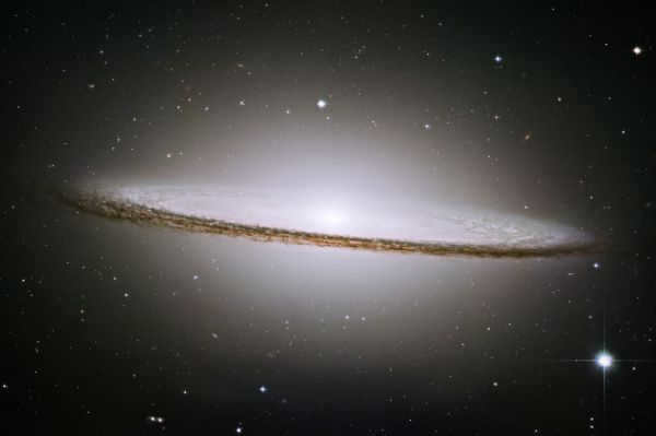 The Sombrero Galaxy is a spiral galaxy in the constellation Virgo at a distance of 28 million light-years from Earth. As shown by recent studies of this object Spitzer telescope, is two galaxies: flat spiral is inside the elliptical. Anomalously high speed of rotation of stars near the center of the study explain the black hole with a mass of 1 billion solar masses. This is one of the most massive black holes currently detected.