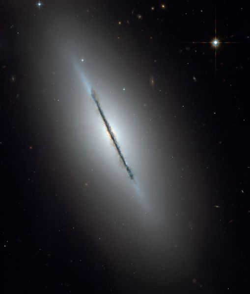 NGC 5866 is a galaxy in the constellation Dragon. The galaxy was apparently discovered in 1781 by French astronomer Pierre Mechene. The galaxy is observed almost from the edge-on view, which allows us to see dark regions of cosmic dust that are in the galactic plane. NGC 5866 is about 44 million light years away. It takes about 60,000 years for light to cross the entire galaxy.