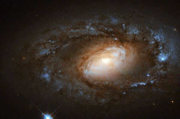 This small and beautiful spiral is known as NGC 4102. In the center of the galaxy there is intense star formation, faster than in other star systems. New stars are forming within a small rotating disk, about 1000 light years in diameter and about three billion solar masses in mass.