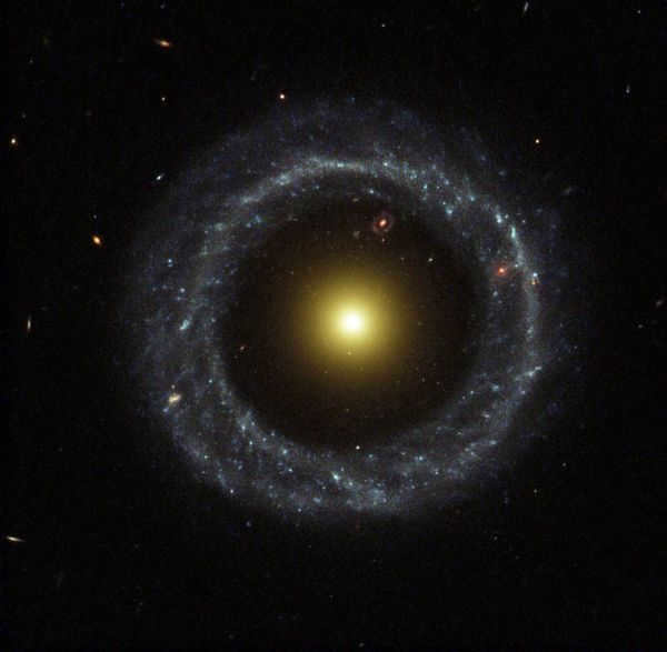 The Hog object is a ring-shaped galaxy in the constellation of the Serpent. The distance to Earth is about 600 million light-years. At the center of the galaxy is a cluster of relatively old yellow stars. It is surrounded by an almost regular ring of younger stars of a blue hue. The galaxy is about 100,000 light-years in diameter. The object was the first ring-shaped galaxy to be discovered. Scientists have no consensus on the processes of formation of such systems. According to one hypothesis, they were formed as a result of the passage of one galaxy through the disk of another.