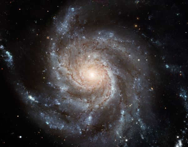 The Spiral Galaxy (M101) is a spiral galaxy in the constellation Big Dipper. We see M101 flat; it is very similar to our Milky Way, only slightly larger in size. The galaxy has pronounced spiral arms and a small, compact bulge. 