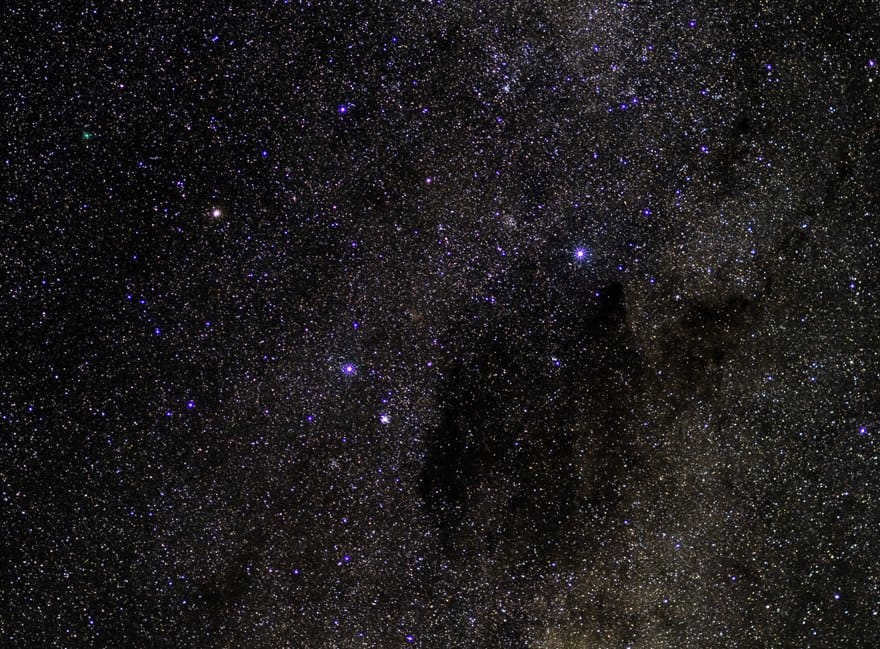 The image shows the Coal Sack Nebula. On the left is Alpha Centauri and Beta Centauri, and on the right is the Southern Cross