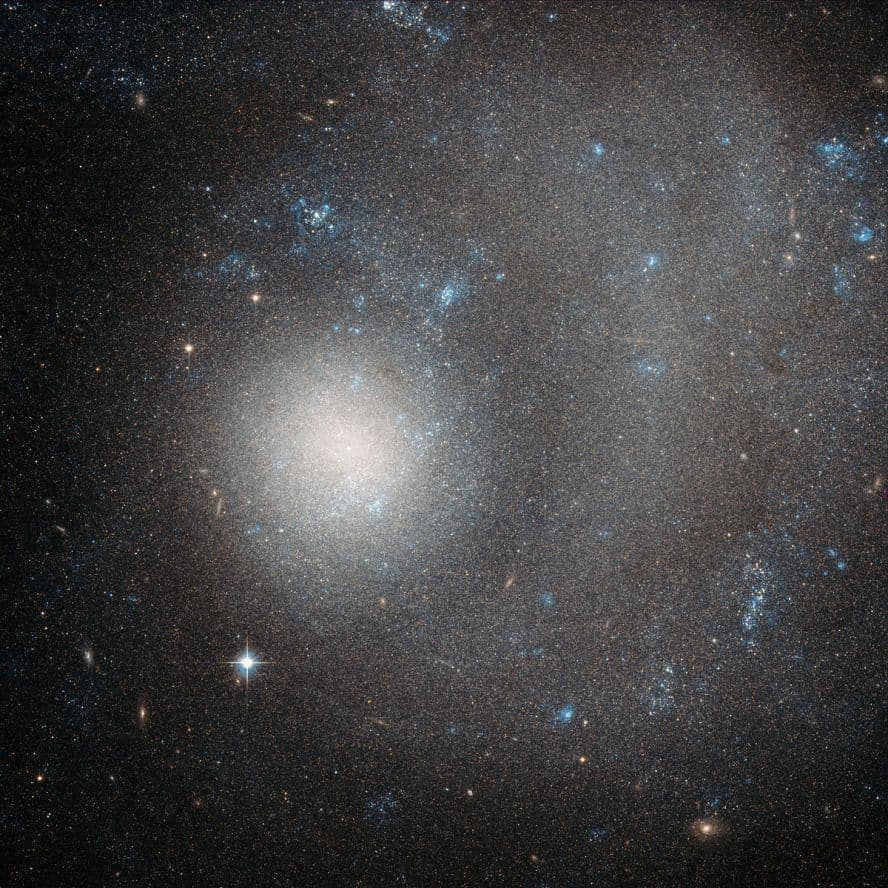 The term "dwarf galaxy" may hint at something tiny, but don't let yourself be fooled. NGC 5474 holds several billion stars! But when compared to the Milky Way (hundreds of billions of stars), NGC 5474 does seem relatively small. It is a member of the M101 group, where the brightest galaxy is Vertushka (M101)