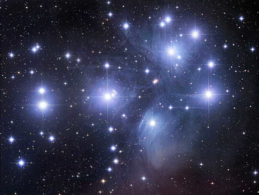 The bright stars in the photo are part of the open star cluster M45 (Pleiades, Seven Sisters). 